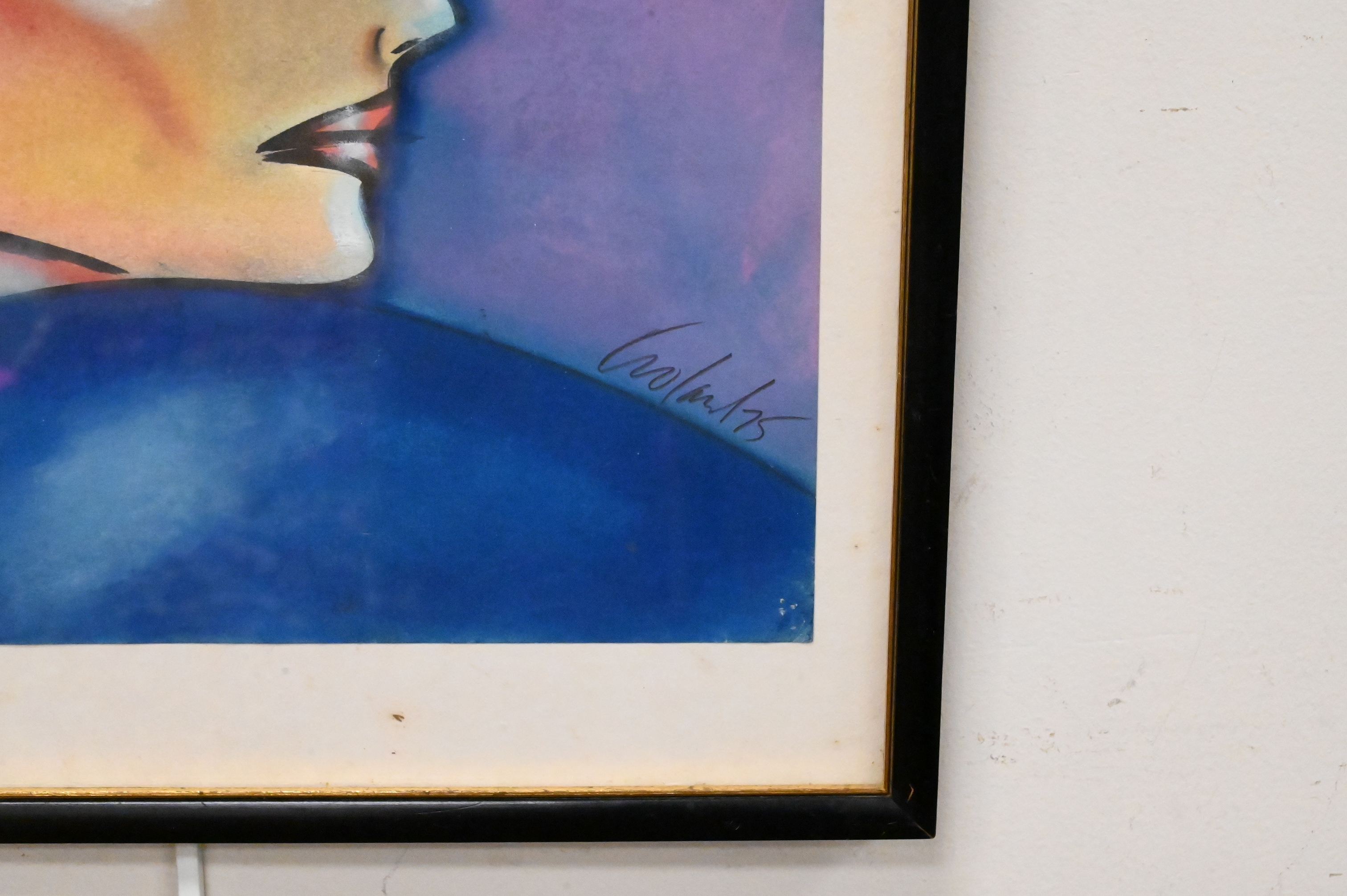 A stylized profile portrait of a figure wearing an elaborate headdress against a blue background.