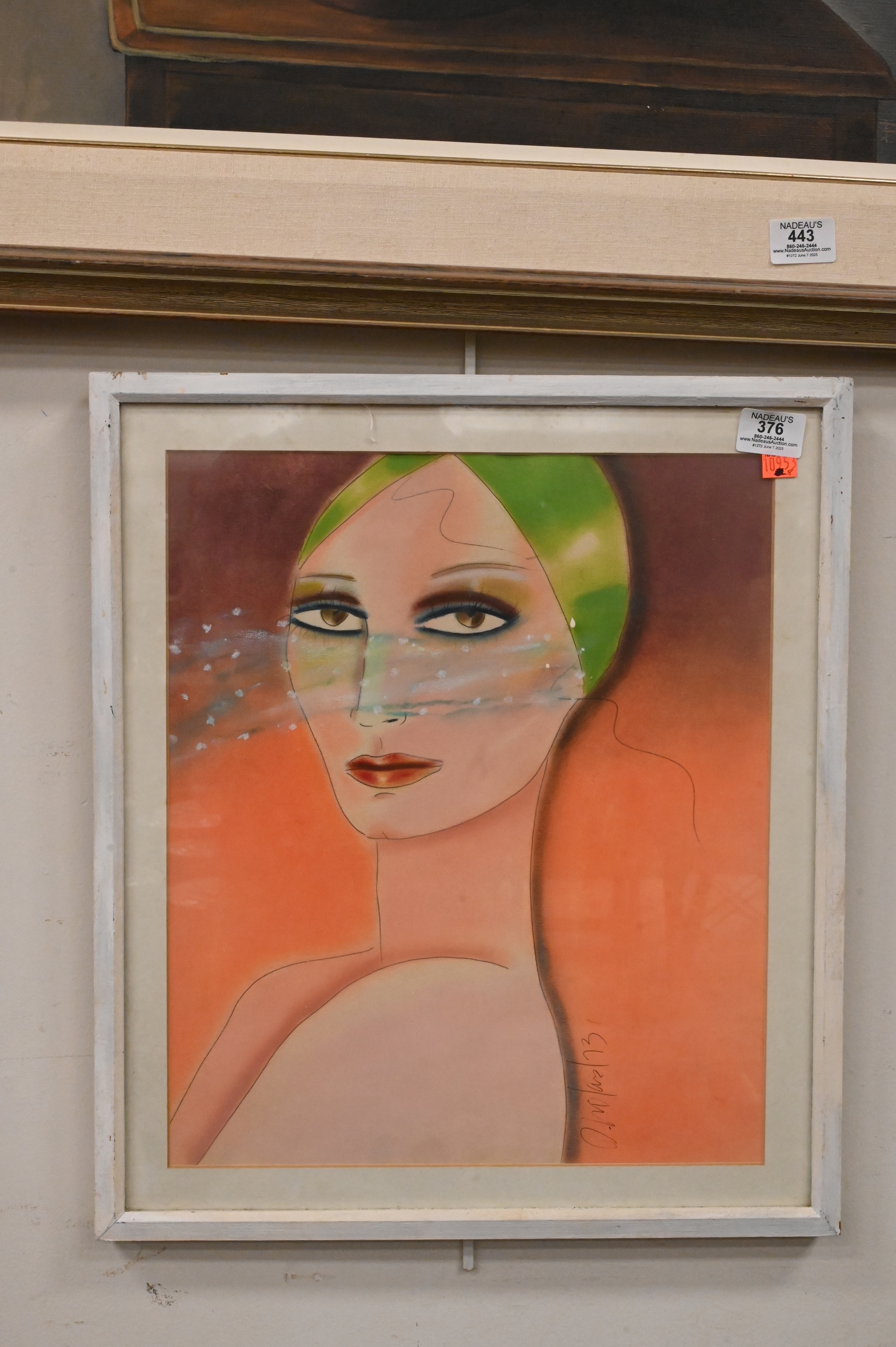 A stylized portrait of a figure with green hair and a translucent blue veil against an orange background.
