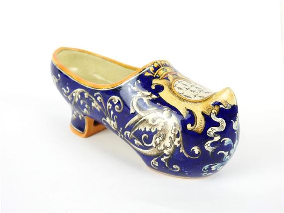 Polychrome earthenware clog with foliage and fantastical animals