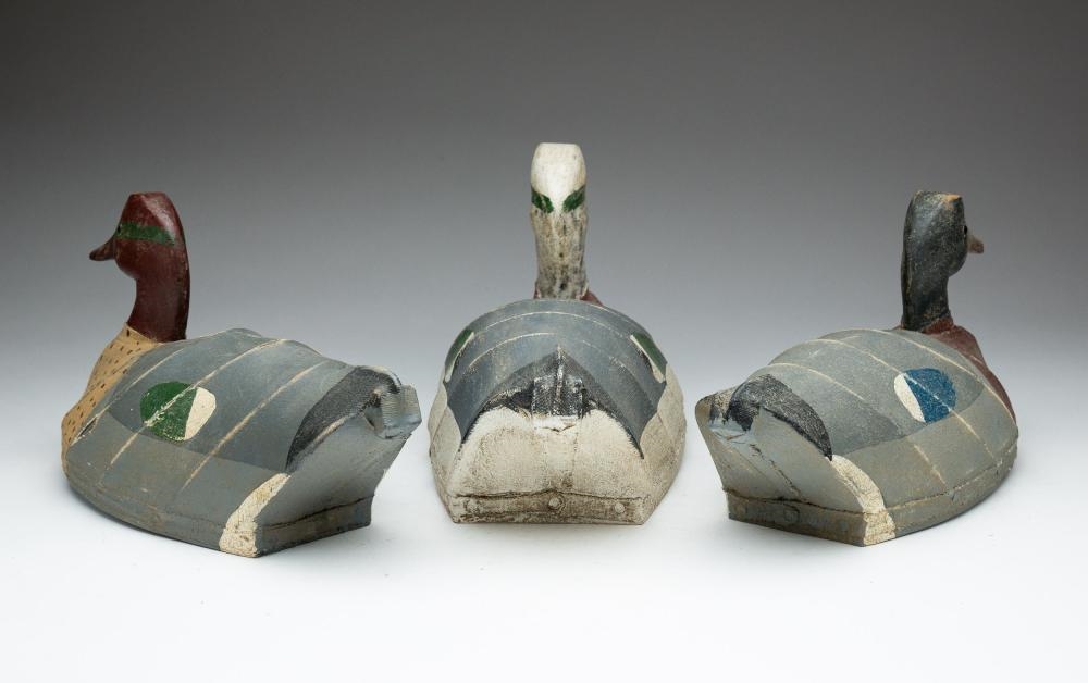 Artwork by William Mosley, THREE WILLIAM MOSLEY (NORTH CAROLINA, 1925-2015) CARVED WOOD AND CANVAS-OVER-WIRE DUCK DECOYS, Made of CARVED WOOD AND CANVAS