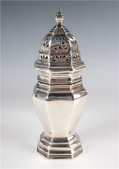 An Edwardian silver octagonal baluster sugar caster with pierced domed cover by Edward Barnard, 1906