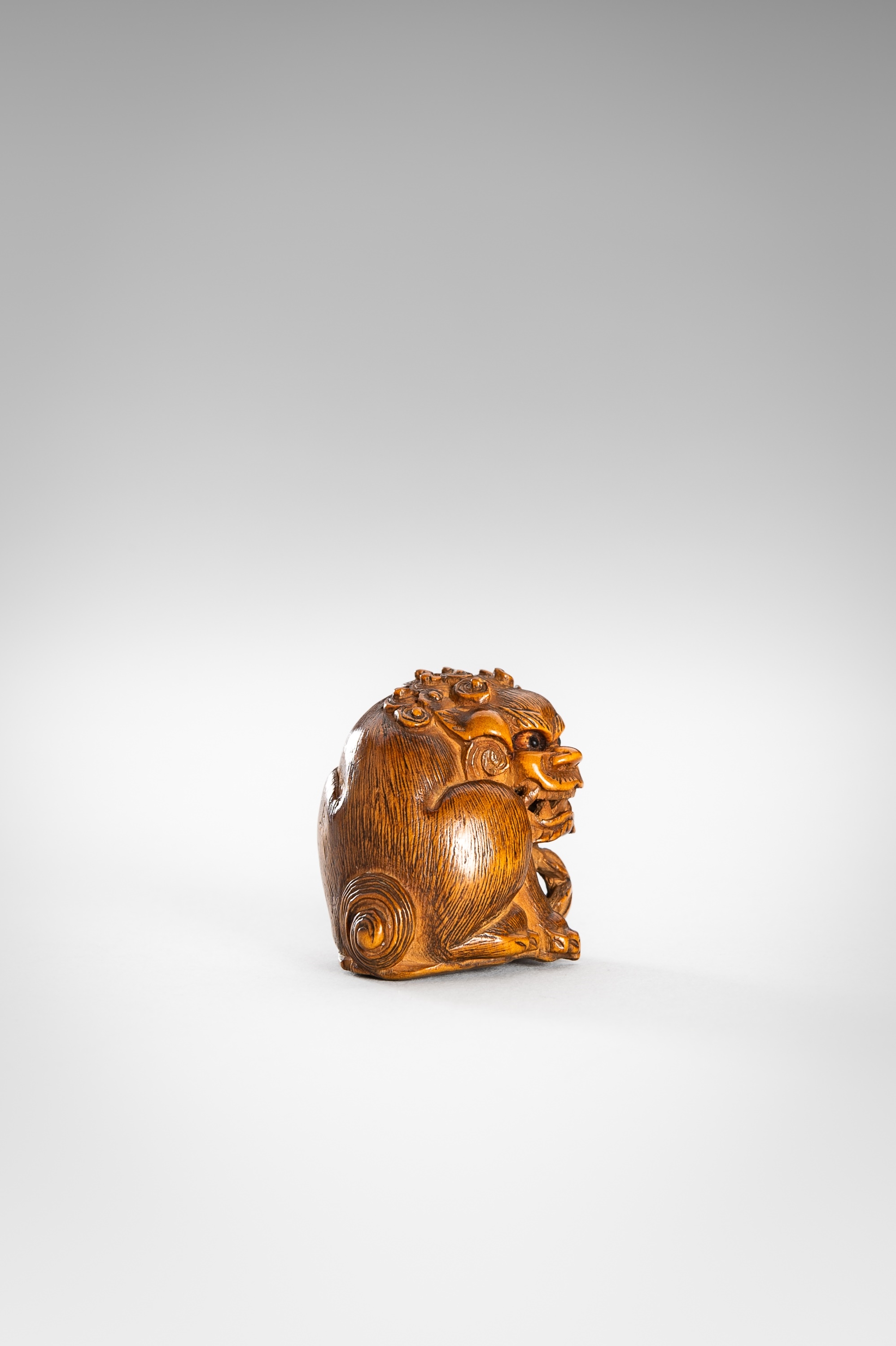 Japanese School, 19th Century | MASAYUKI: A WOOD NETSUKE OF A SHISHI ...