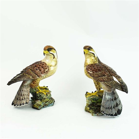A PAIR OF CERAMIC FALCONS - Anne Gordon