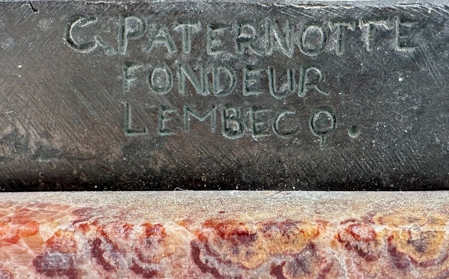 Artwork by Oscar De Beul, Young mother with child resting on a chair, Made of Bronze