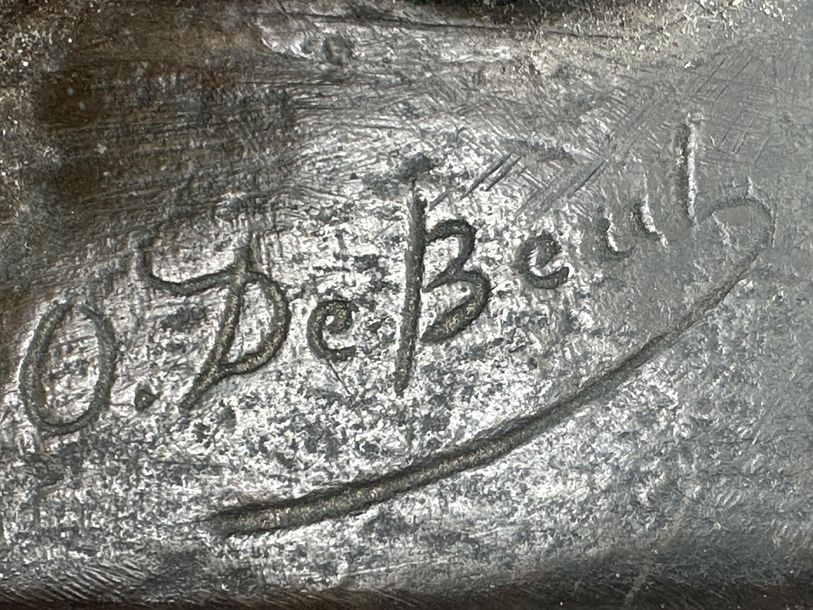 Artwork by Oscar De Beul, Young mother with child resting on a chair, Made of Bronze