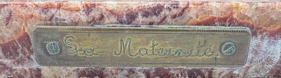 Artwork by Oscar De Beul, Young mother with child resting on a chair, Made of Bronze