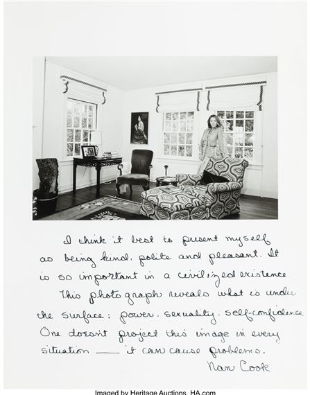 A black-and-white interior portrait of a seated figure in a patterned armchair, accompanied by handwritten text.
