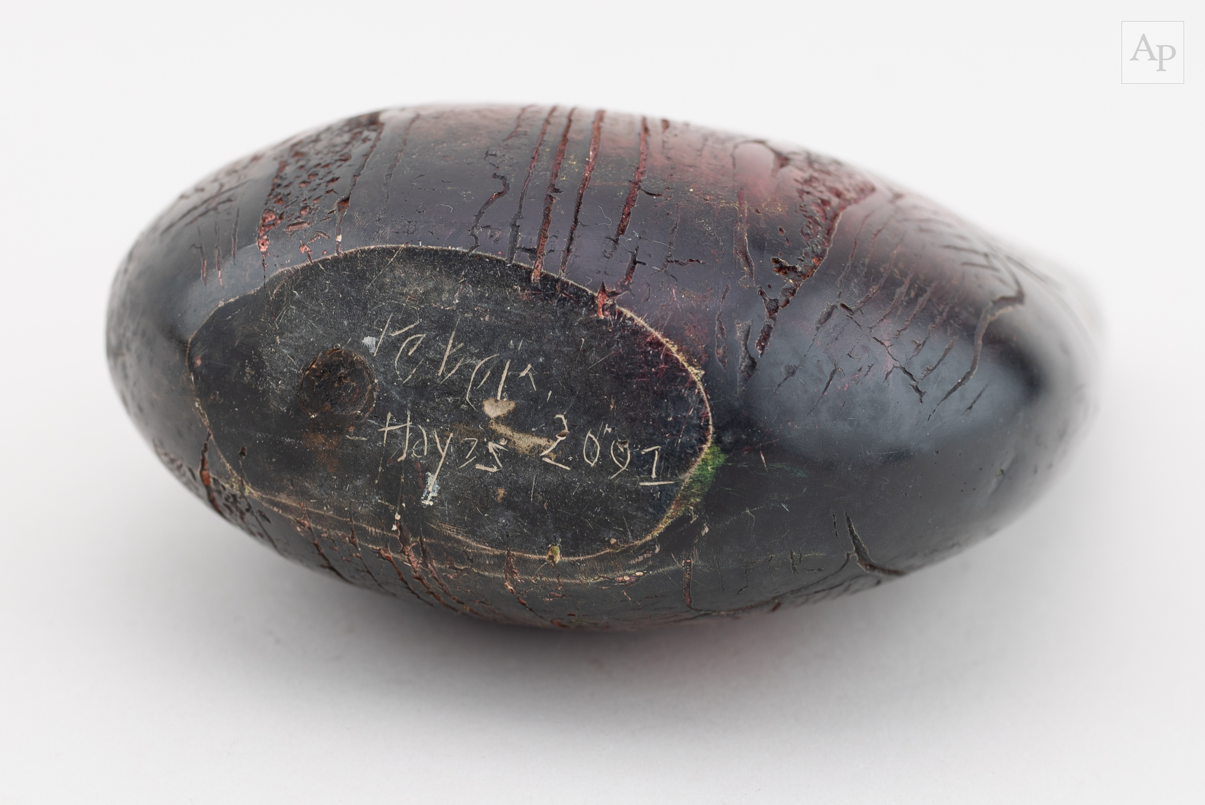 Artwork by Peter Hayes, a raku bow with fractured red and black smoky surface and keyhole, Made of raku