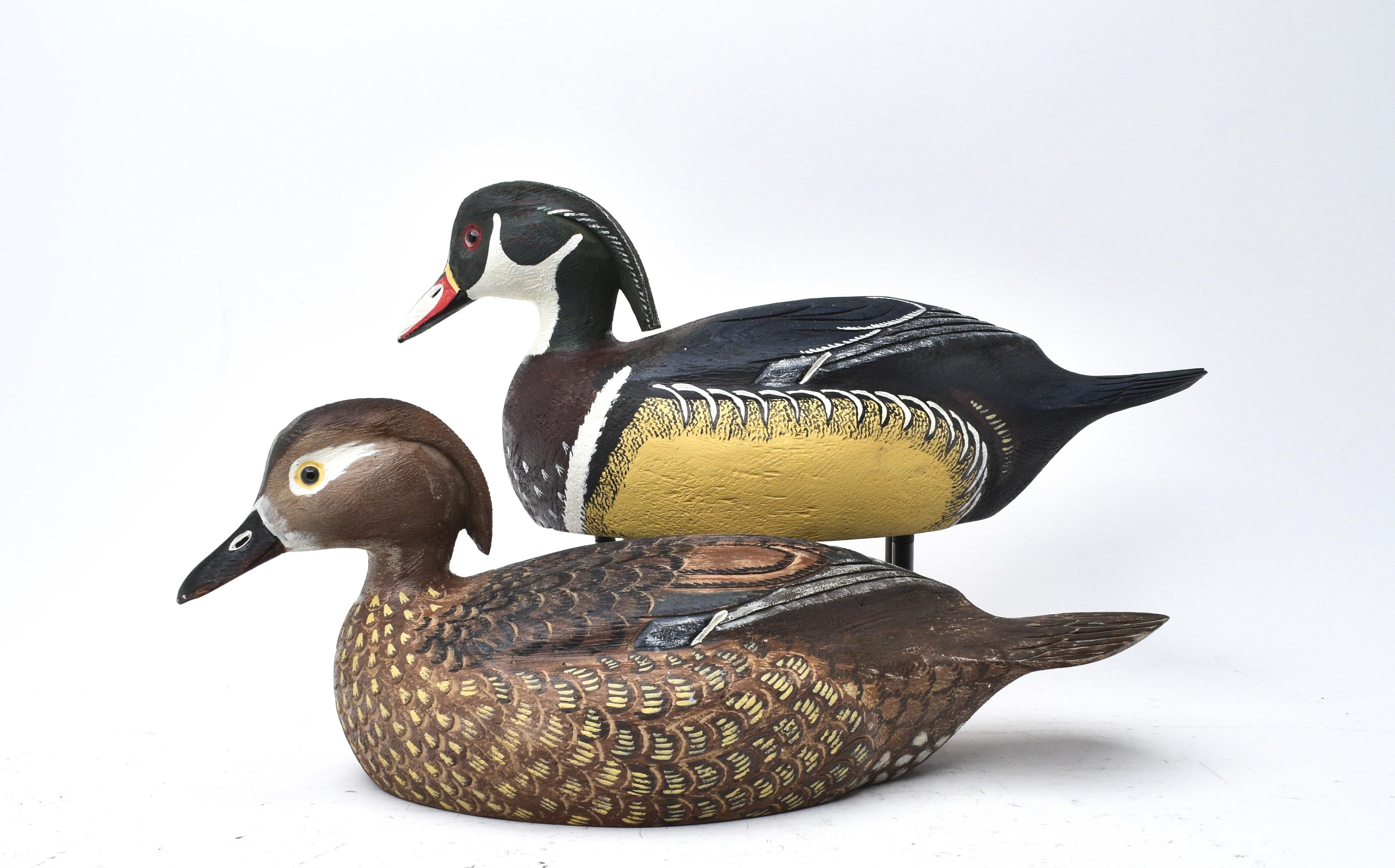 Artwork by Ralph Malpage, Pair of wood duck decoratives, Made of wood, glass eyes, detail carving throughout