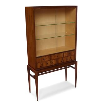 Vitrine
circa 1960s
rosewood, sycamore, glass, with firm's branded mark
height 55 1/2in (140.8cm); width 29 1/4in (74.5cm); depth 12 1/2in (32cm - Svante Skogh
