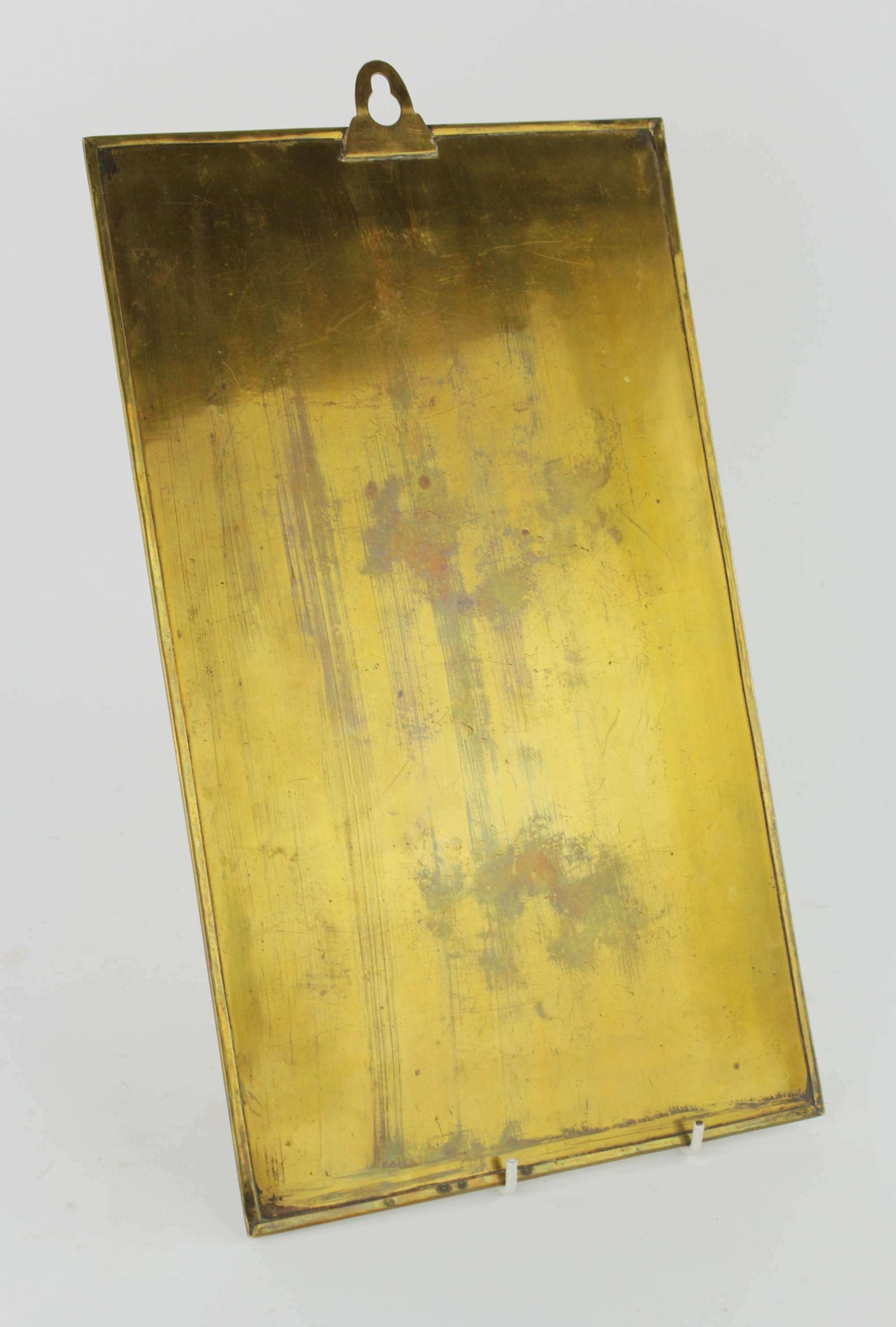 Artwork by Bruce Talbert, MANNER OF BRUCE TALBERT, a rectangular brass plaque, decorated with a bird flying towards the sun, above lotus plants, in a border of fruit and flowers, 38 x 23cm, Made of brass plaque