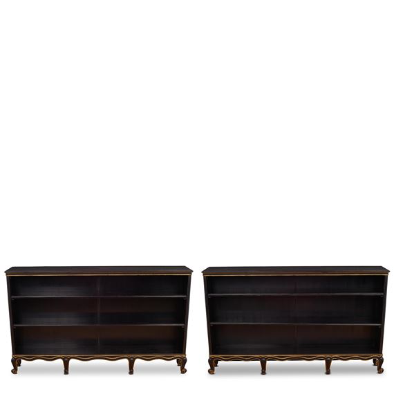 Pair of Rococo-Style Bookcases
circa 1931
for Nordiska Kompaniet, ebonized wood, parcel gilt, each with Nordiska Kompaniet plaques numbered 'R35777 - C19005'
height of each 39 1/2in (100cm); width 65 3/4in (167cm); depth 11 1/4in (28.5cm - Sven Toresson