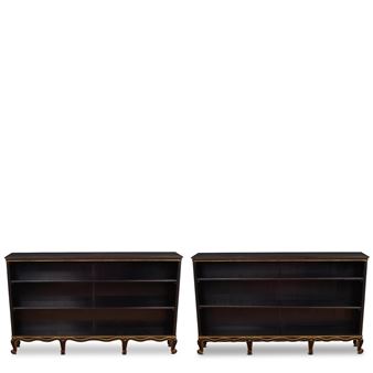 Pair of Rococo-Style Bookcases
circa 1931
for Nordiska Kompaniet, ebonized wood, parcel gilt, each with Nordiska Kompaniet plaques numbered 'R35777 - C19005'
height of each 39 1/2in (100cm); width 65 3/4in (167cm); depth 11 1/4in (28.5cm - Sven Toresson