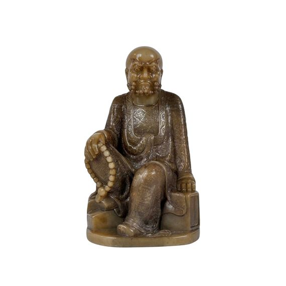 A CHINESE SHOUSHAN STONE ARHAT FIGURE by Chinese School