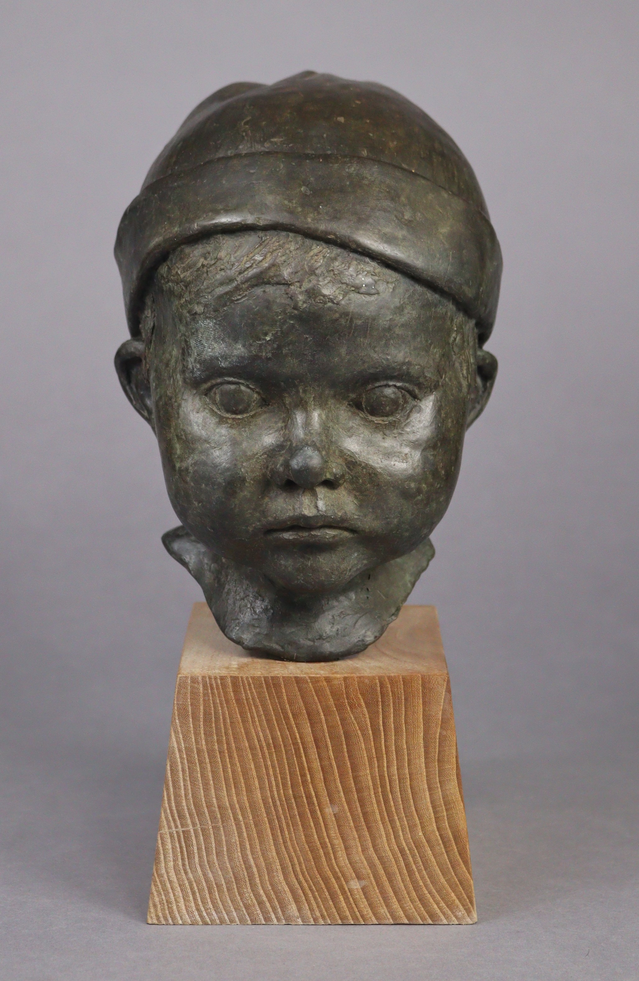 Artwork by Jeremy Stiff, A bronze sculpture of the head of a boy, Made of bronze