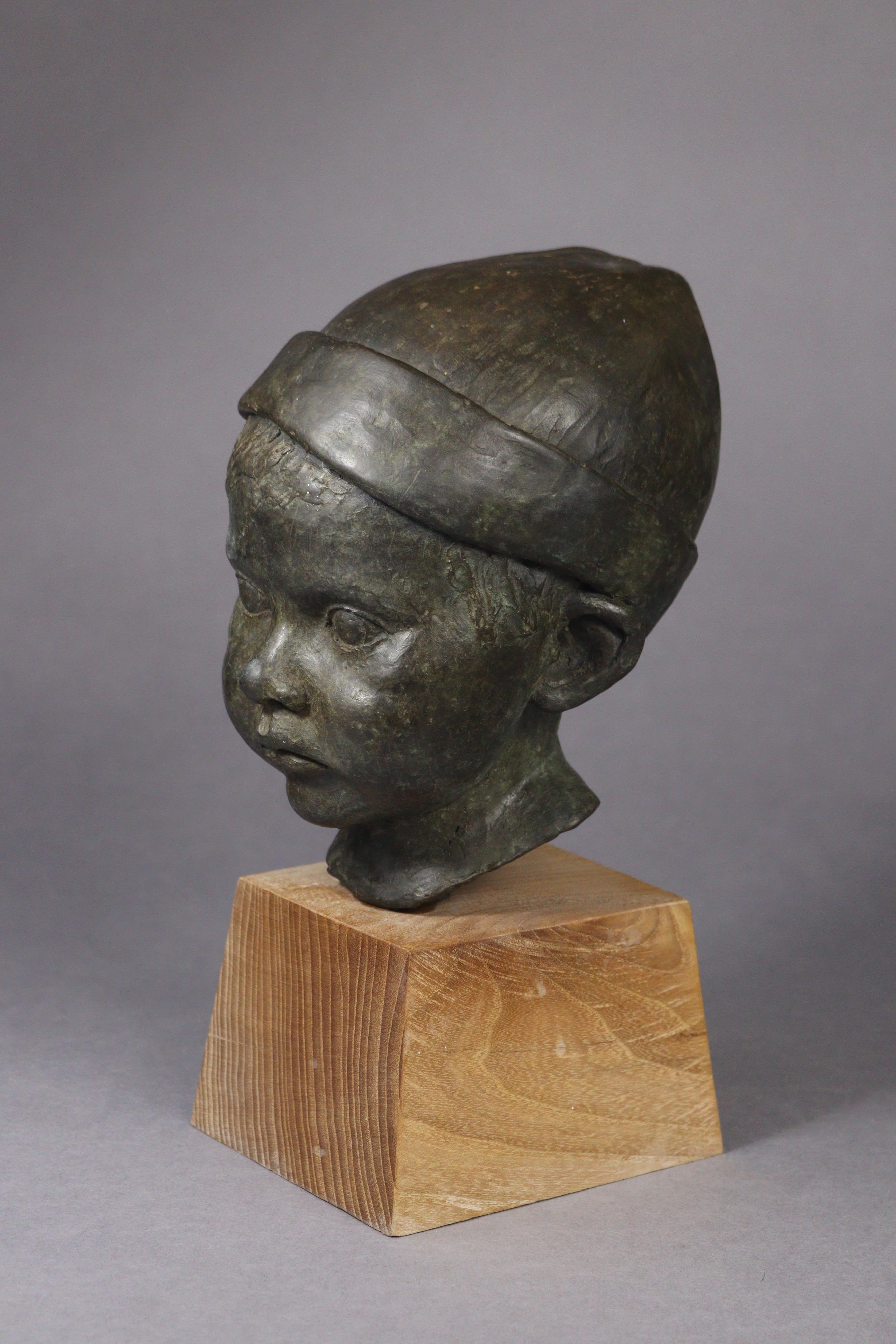 Artwork by Jeremy Stiff, A bronze sculpture of the head of a boy, Made of bronze