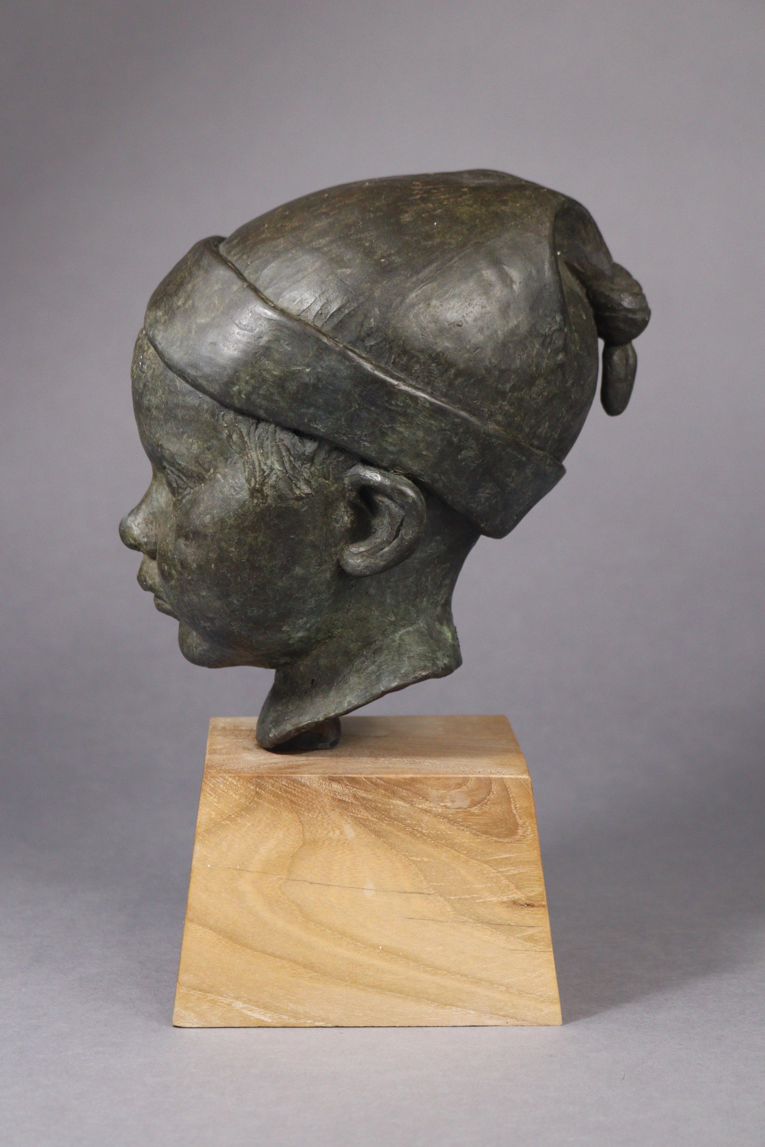 Artwork by Jeremy Stiff, A bronze sculpture of the head of a boy, Made of bronze