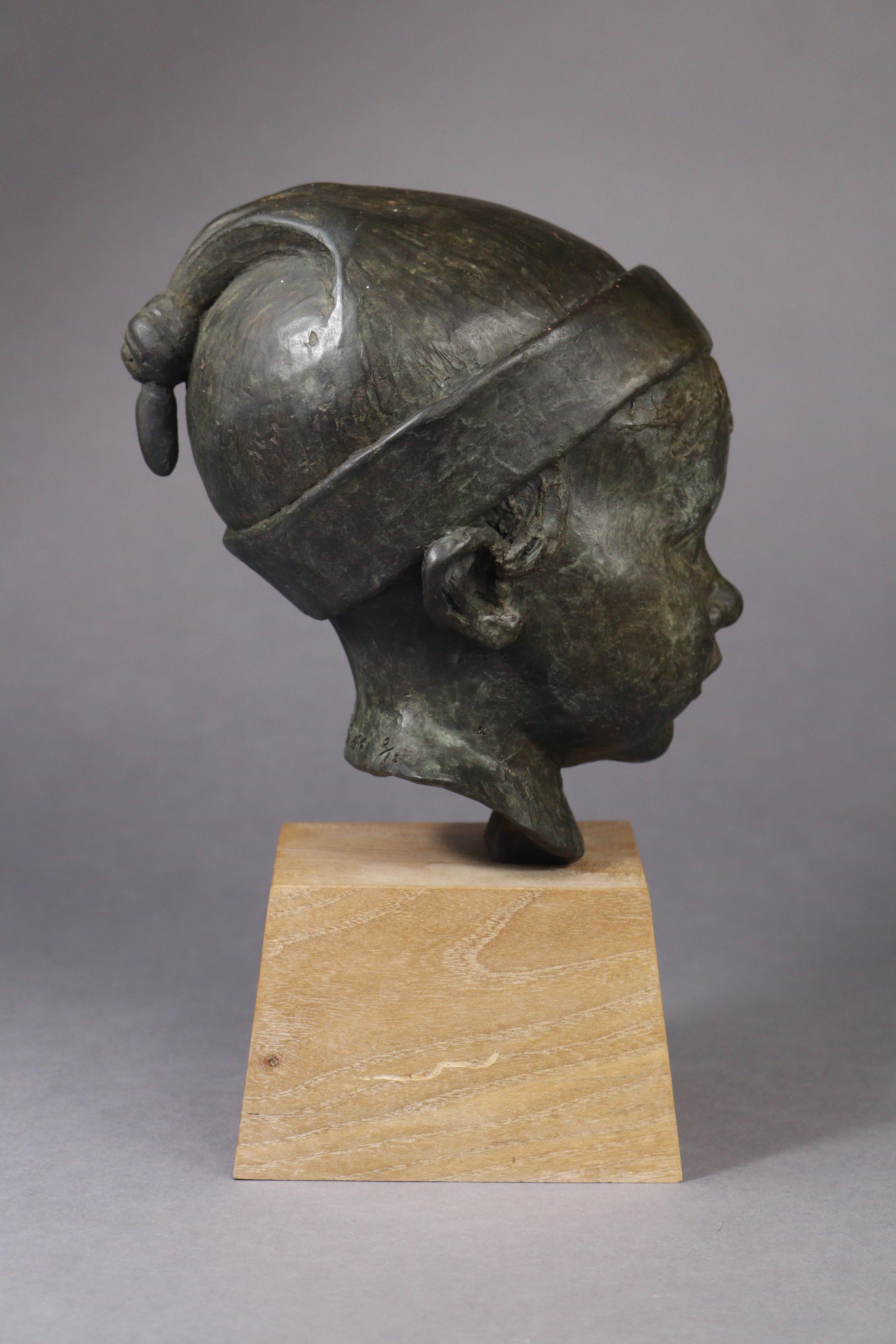 Artwork by Jeremy Stiff, A bronze sculpture of the head of a boy, Made of bronze