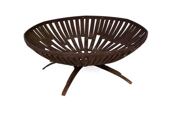 Footed dish form metal sculpture made with railroad spikes,