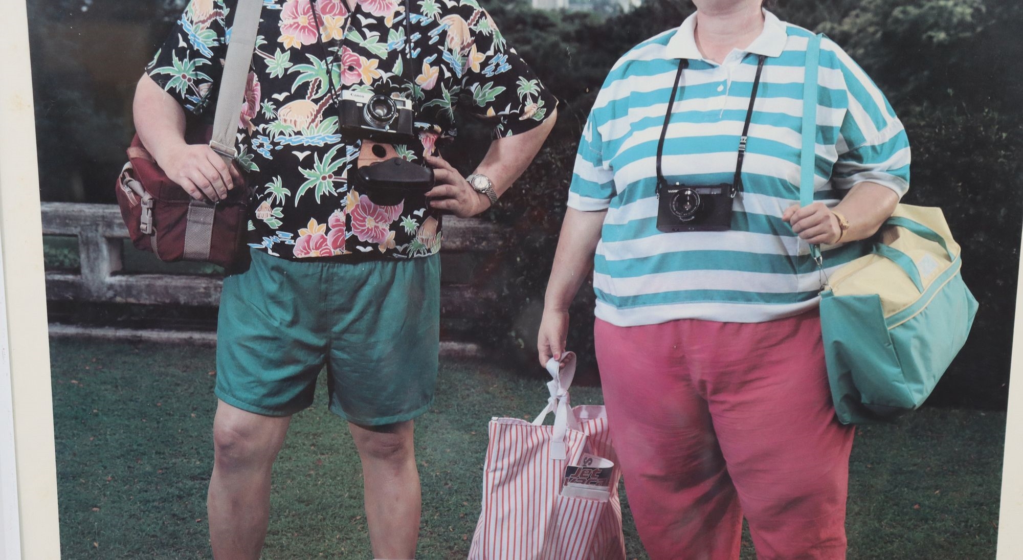 Artwork by Duane Hanson, Two of the artist's stunningly lifelike figures as bored tourists in a tropical paradise, Made of Poster