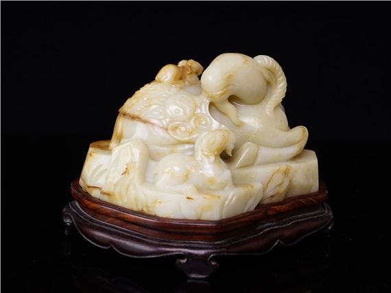 A Fine Chinese White and Russet Jade Carving of Rams Group with Wood Stand by Chinese School