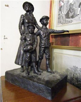 A bronze statue of a woman and two children.