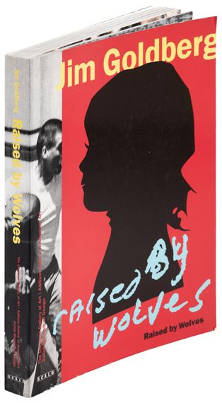 A bold red book cover featuring a black silhouette of a person's head and shoulders against a vibrant background.