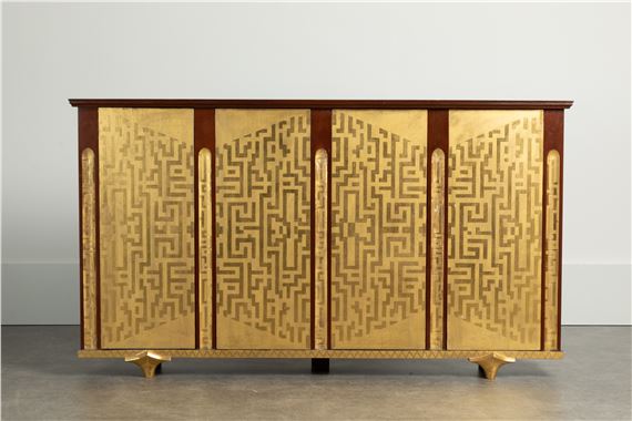 A palm-veneered, redwood and ebonised cabinet - Eugène Printz