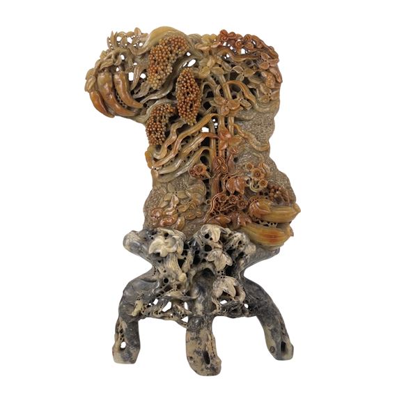 A LARGE CHINESE CARVED SOAPSTONE ORNAMENT by Chinese School