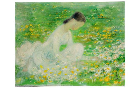 Woman in a field of daisies