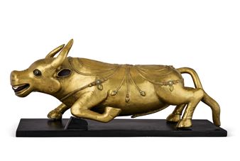 A GILT BRONZE FIGURE OF A BULL - Mongolian School, 18th Century