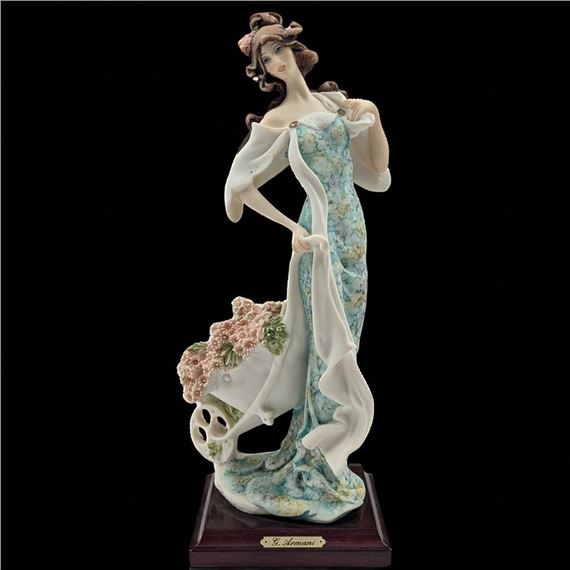 Girl With Wheelbarrow Of Flowers