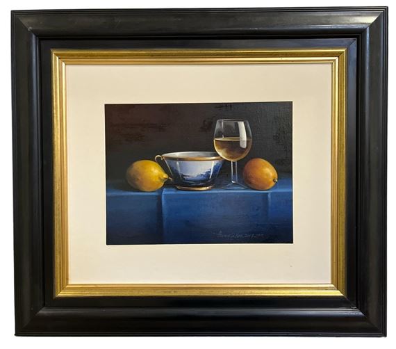 A still life painting featuring a cup, wine glass, and lemons on a blue surface.