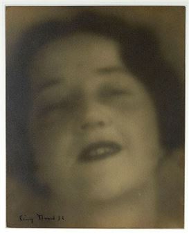 A vintage-style portrait of a smiling figure with soft focus and sepia tones.