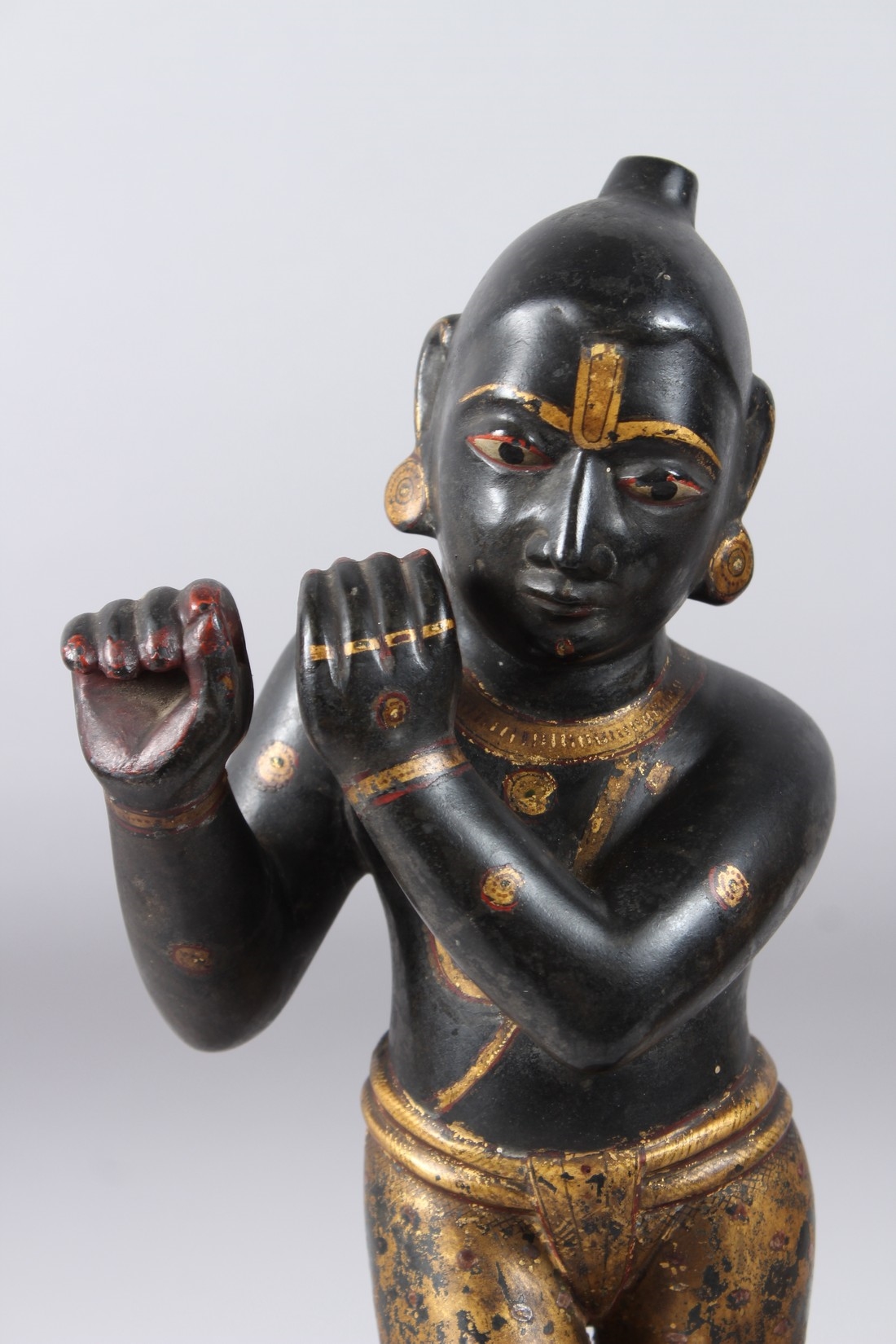 Artwork by Indian School, 19th Century, A LARGE AND FINELY CARVED EARLY 19TH CENTURY INDIAN PAINTED AND GILDED STONE FIGURES OF KRISHNA, Made of Painted And Gilded Stone