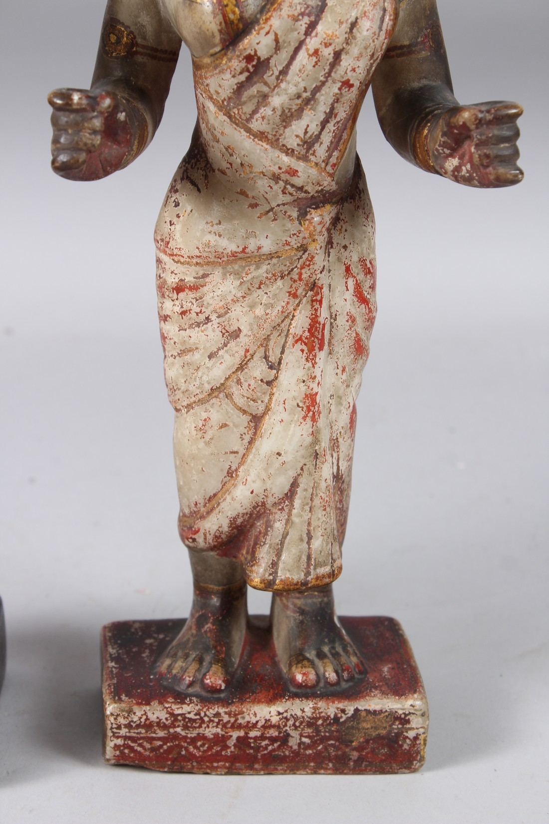 Artwork by Indian School, 19th Century, A LARGE AND FINELY CARVED EARLY 19TH CENTURY INDIAN PAINTED AND GILDED STONE FIGURES OF KRISHNA, Made of Painted And Gilded Stone