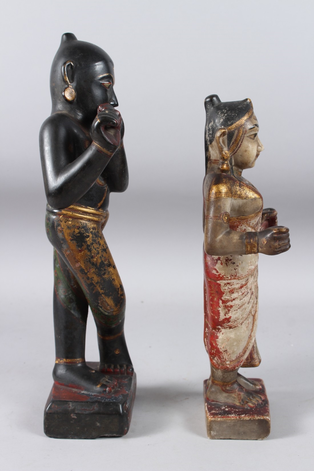 Artwork by Indian School, 19th Century, A LARGE AND FINELY CARVED EARLY 19TH CENTURY INDIAN PAINTED AND GILDED STONE FIGURES OF KRISHNA, Made of Painted And Gilded Stone
