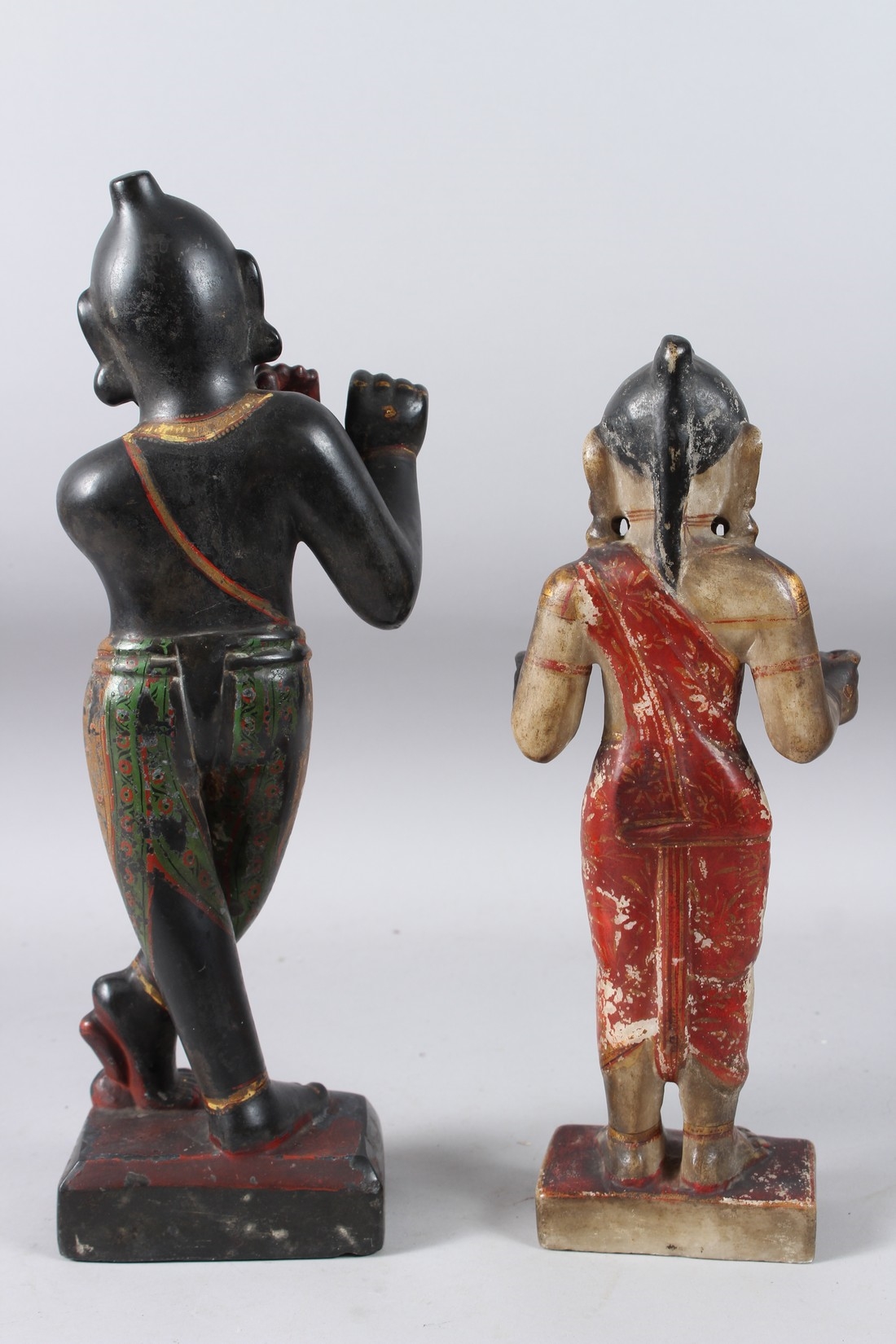 Artwork by Indian School, 19th Century, A LARGE AND FINELY CARVED EARLY 19TH CENTURY INDIAN PAINTED AND GILDED STONE FIGURES OF KRISHNA, Made of Painted And Gilded Stone