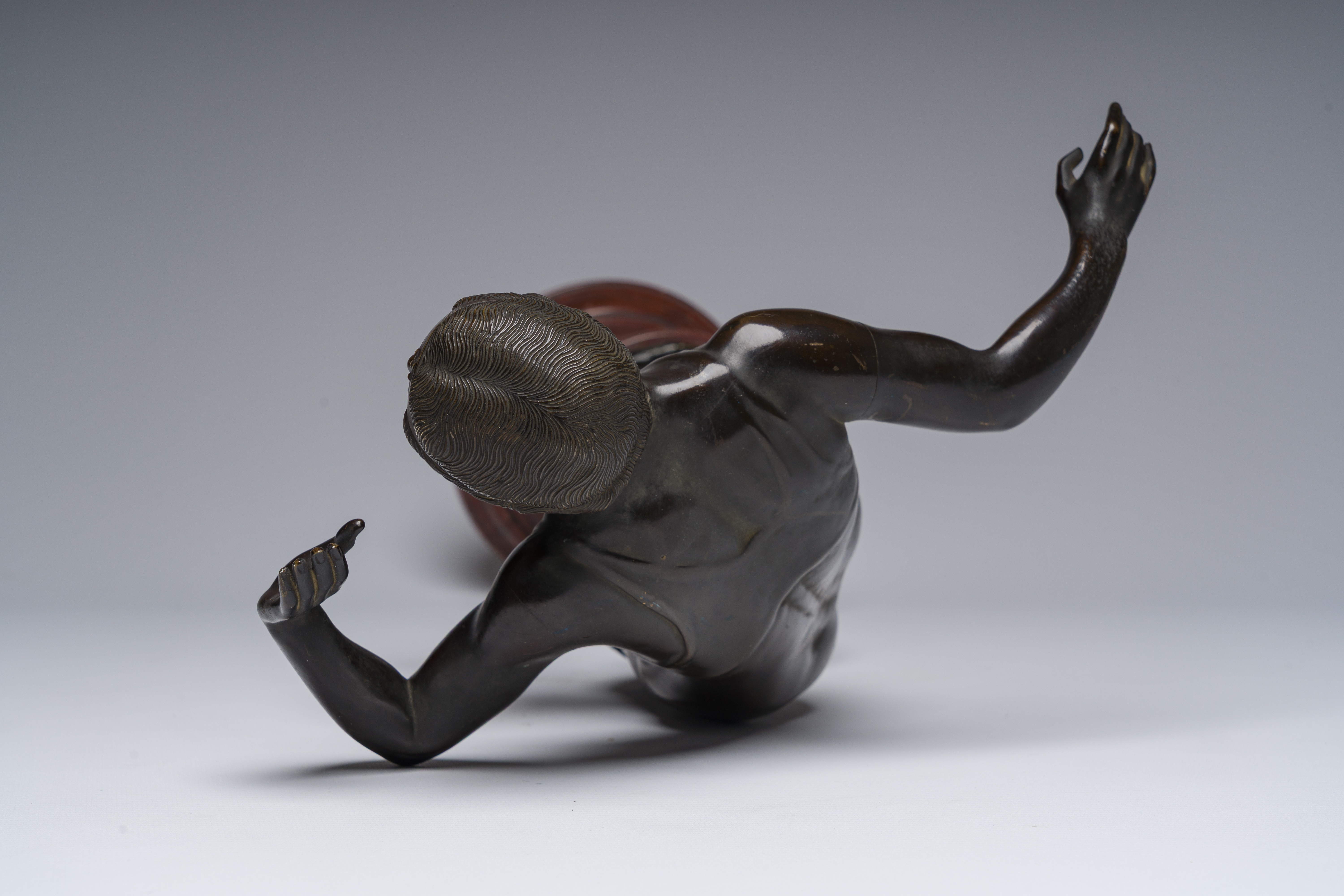 Artwork by Rudolf Marcuse, Dancer, Made of patinated bronze on a red marble base