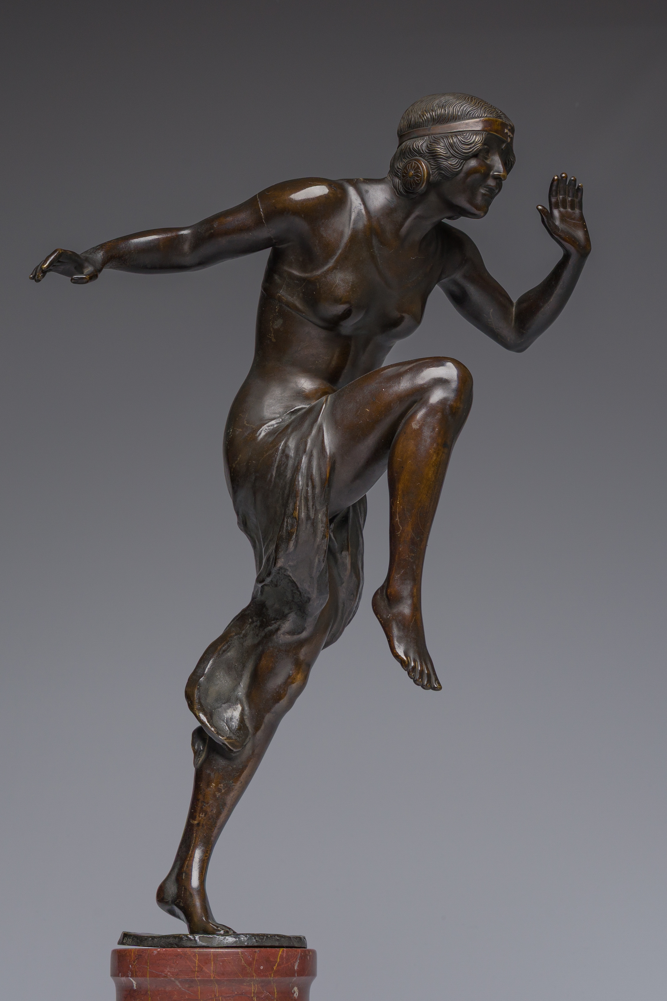 Artwork by Rudolf Marcuse, Dancer, Made of patinated bronze on a red marble base