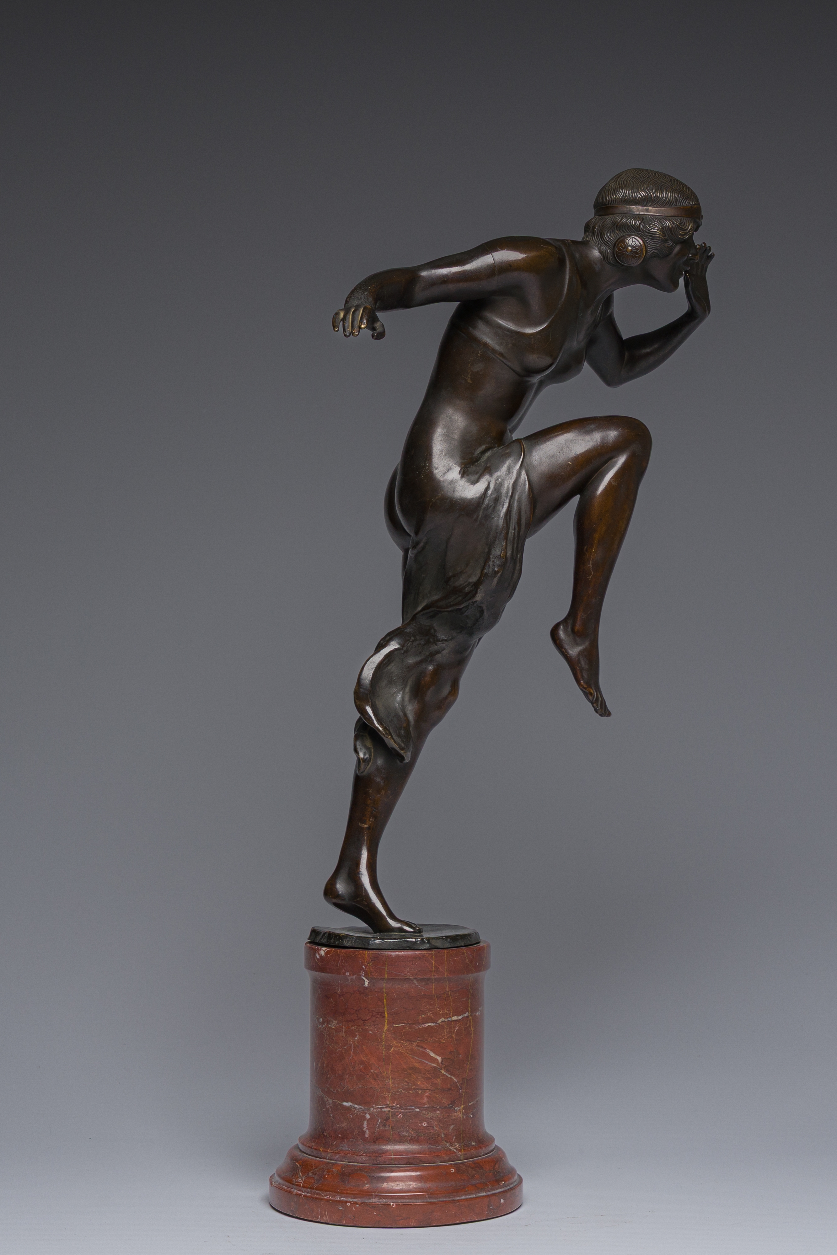 Artwork by Rudolf Marcuse, Dancer, Made of patinated bronze on a red marble base