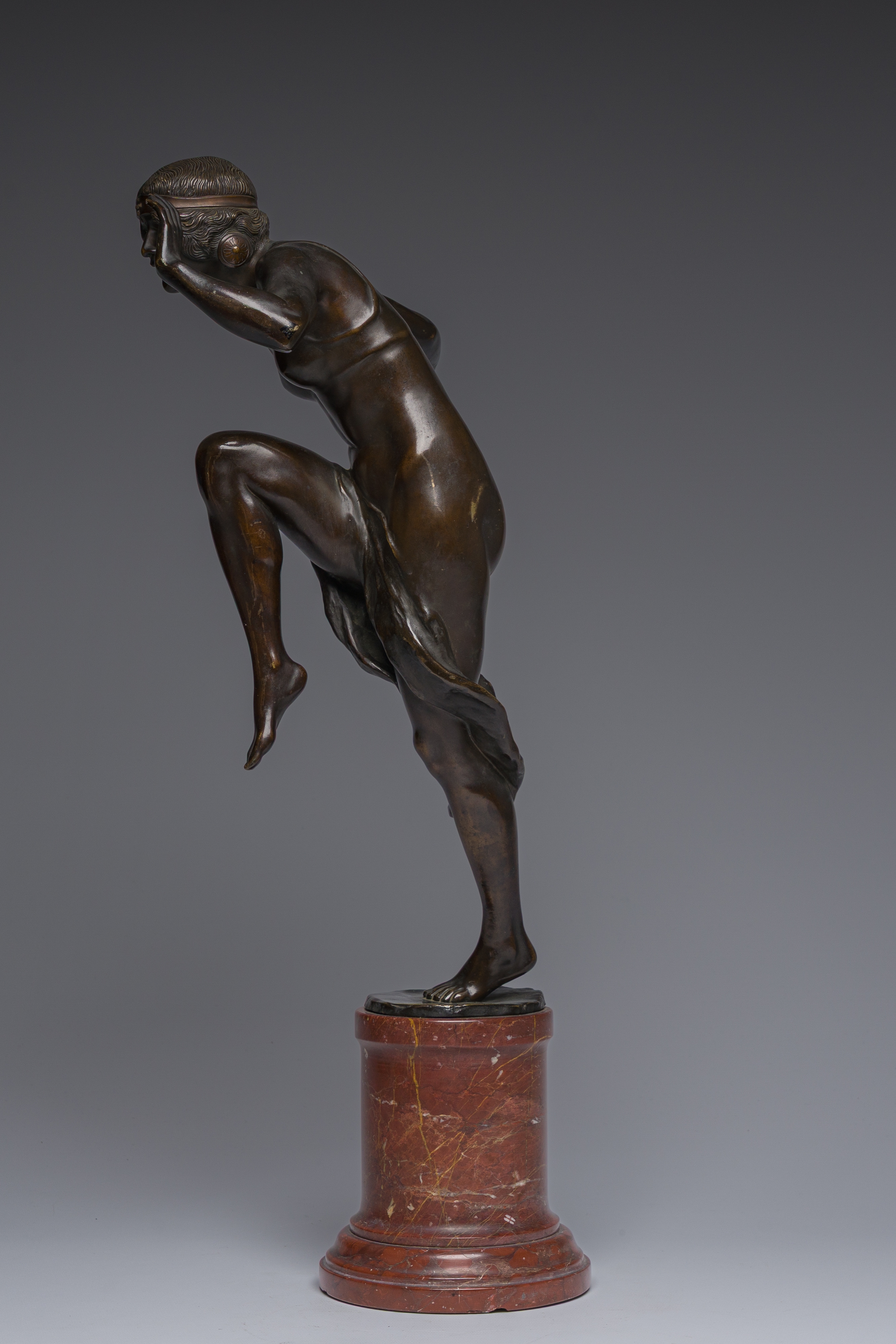Artwork by Rudolf Marcuse, Dancer, Made of patinated bronze on a red marble base