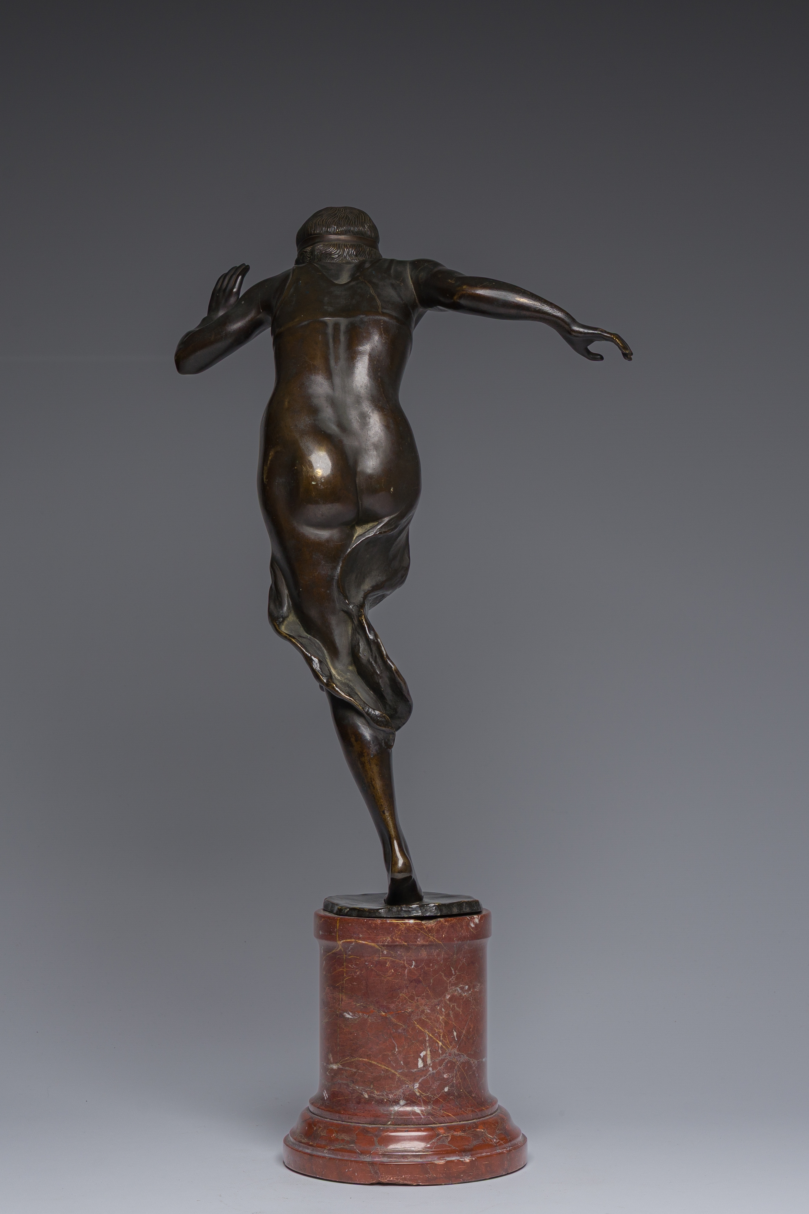 Artwork by Rudolf Marcuse, Dancer, Made of patinated bronze on a red marble base