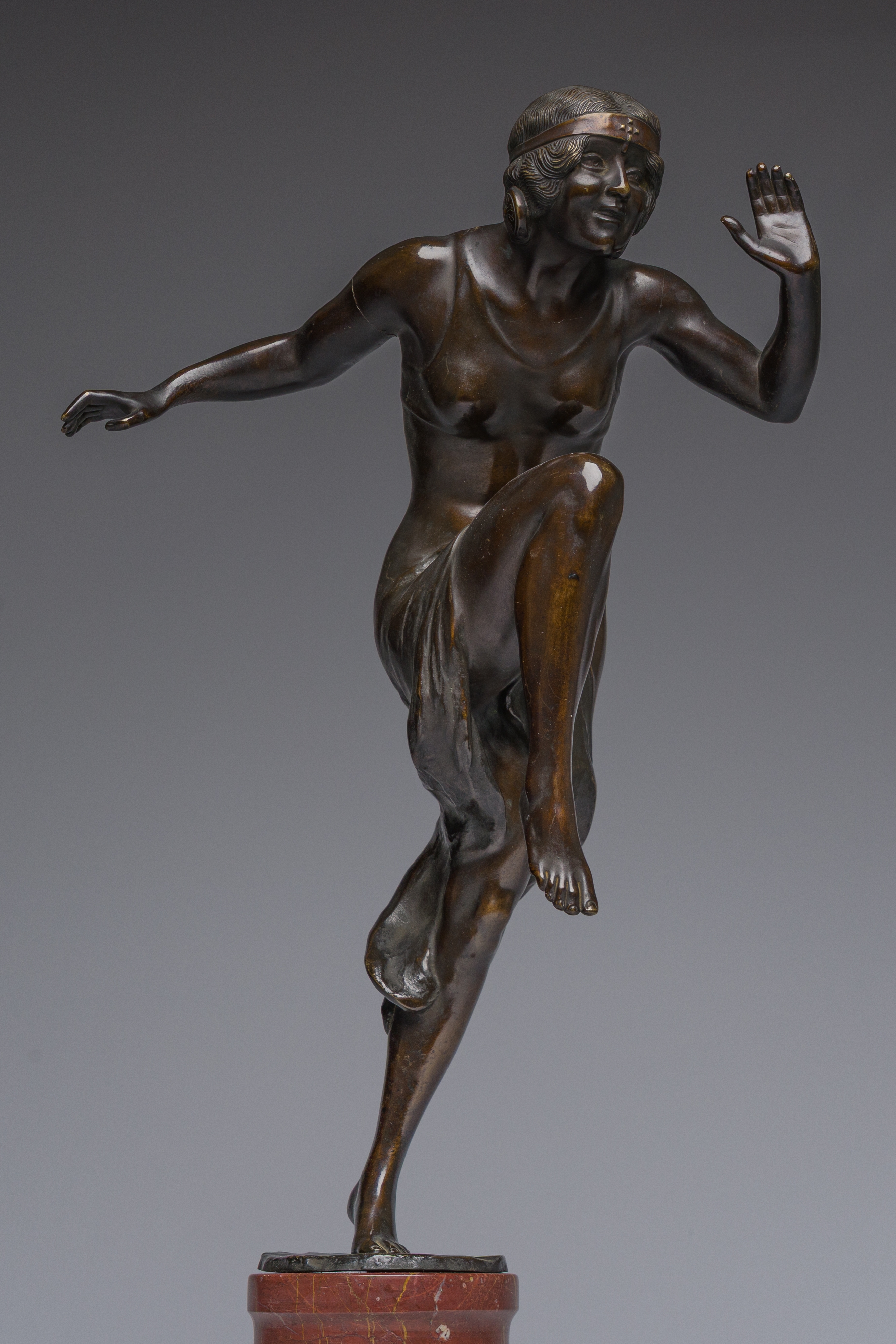 Artwork by Rudolf Marcuse, Dancer, Made of patinated bronze on a red marble base