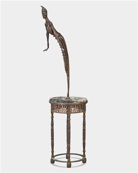 A surreal sculpture of a figure emerging from a decorative pedestal.