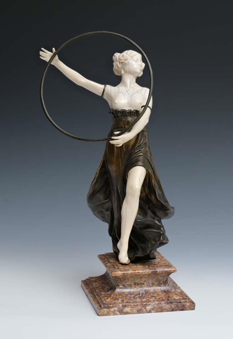 Artwork by Charles Arthur Muller, Charles Arthur Muller (1868-ca. 1930), een brons en ivoren art nouveau sculptuur van een dansende dame met hoepel, Made of bronze