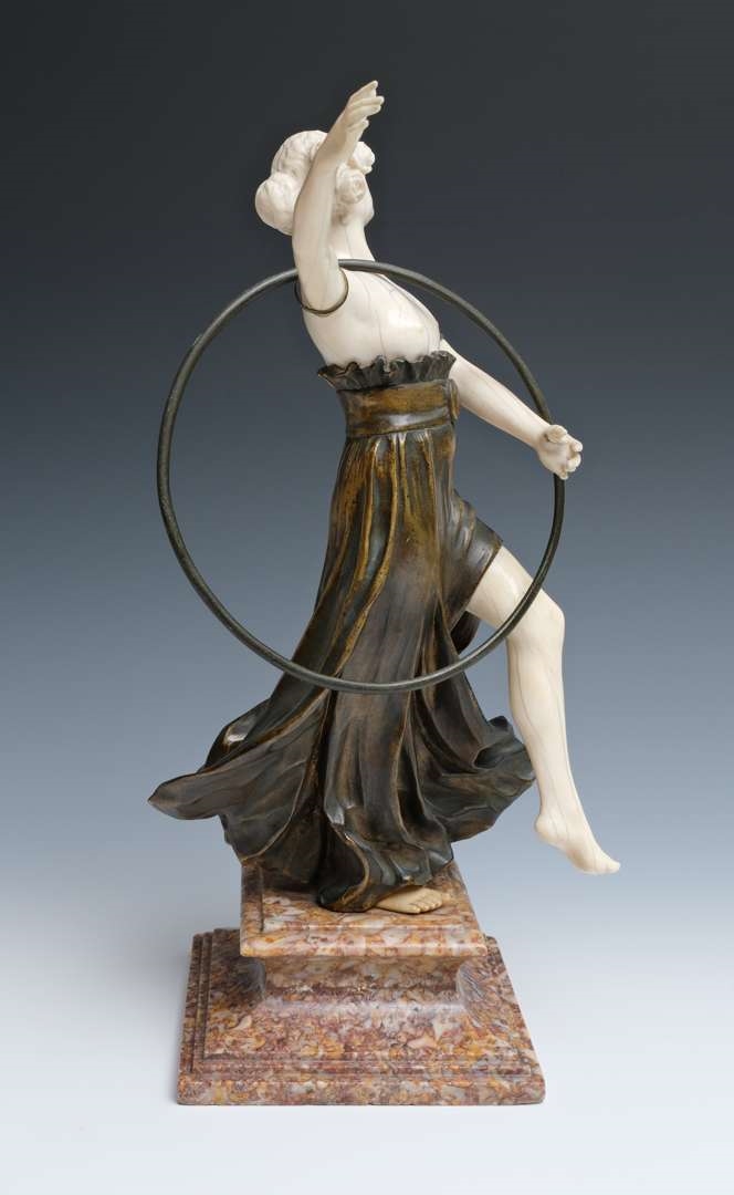 Artwork by Charles Arthur Muller, Charles Arthur Muller (1868-ca. 1930), een brons en ivoren art nouveau sculptuur van een dansende dame met hoepel, Made of bronze