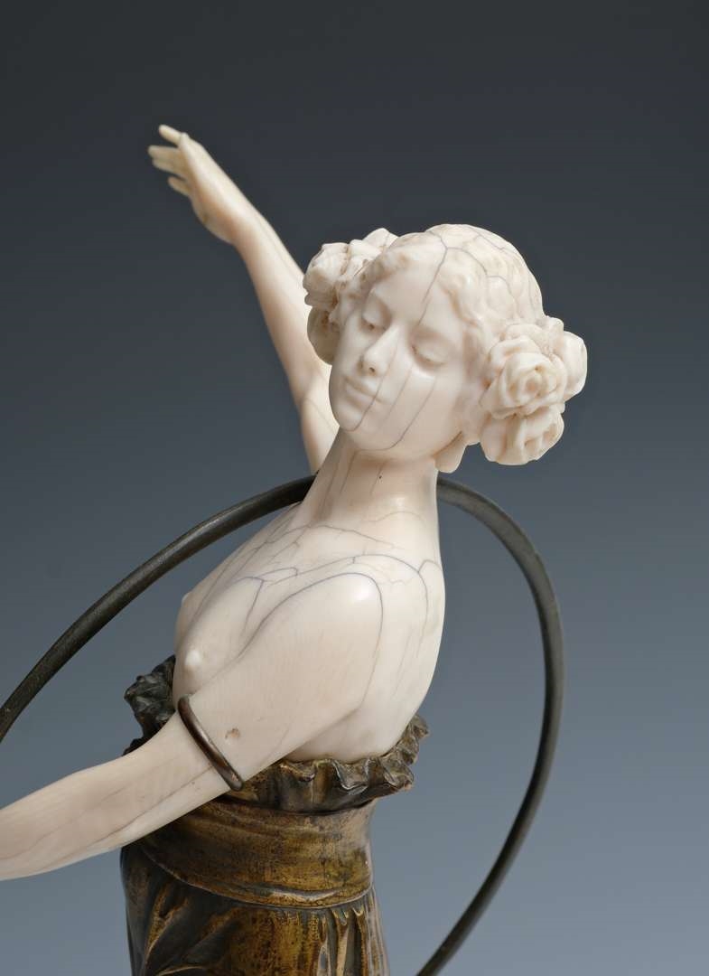 Artwork by Charles Arthur Muller, Charles Arthur Muller (1868-ca. 1930), een brons en ivoren art nouveau sculptuur van een dansende dame met hoepel, Made of bronze