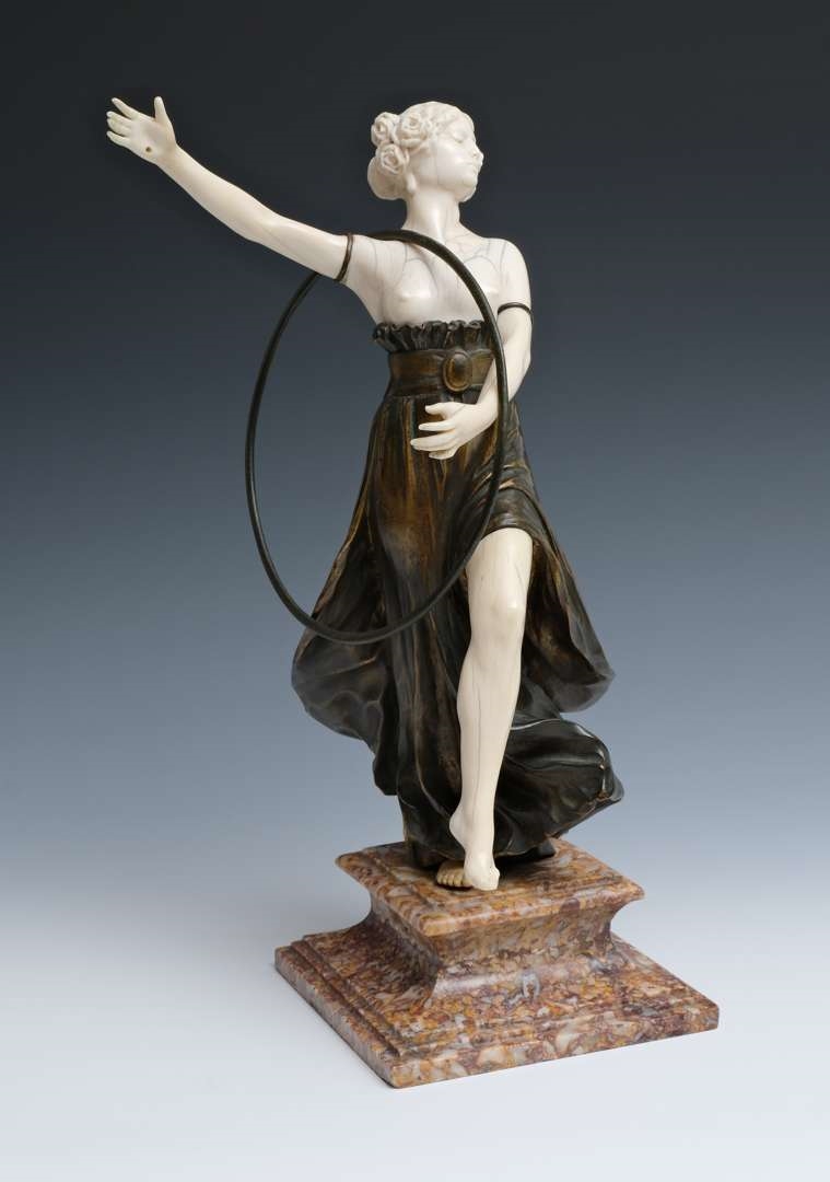 Artwork by Charles Arthur Muller, Charles Arthur Muller (1868-ca. 1930), een brons en ivoren art nouveau sculptuur van een dansende dame met hoepel, Made of bronze