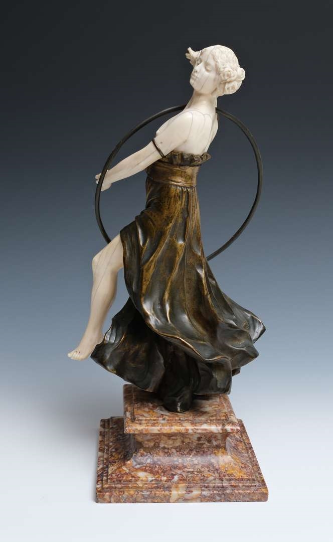 Artwork by Charles Arthur Muller, Charles Arthur Muller (1868-ca. 1930), een brons en ivoren art nouveau sculptuur van een dansende dame met hoepel, Made of bronze